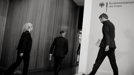 Thomas De Maizière offering an official press statement about refugees. This picture is from the project "Rebordering Europe" by Kaveh Rostamkhani.